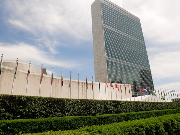 Modern office building with international flags representing global business.