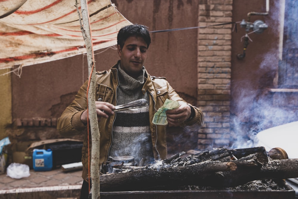 man holding banknote