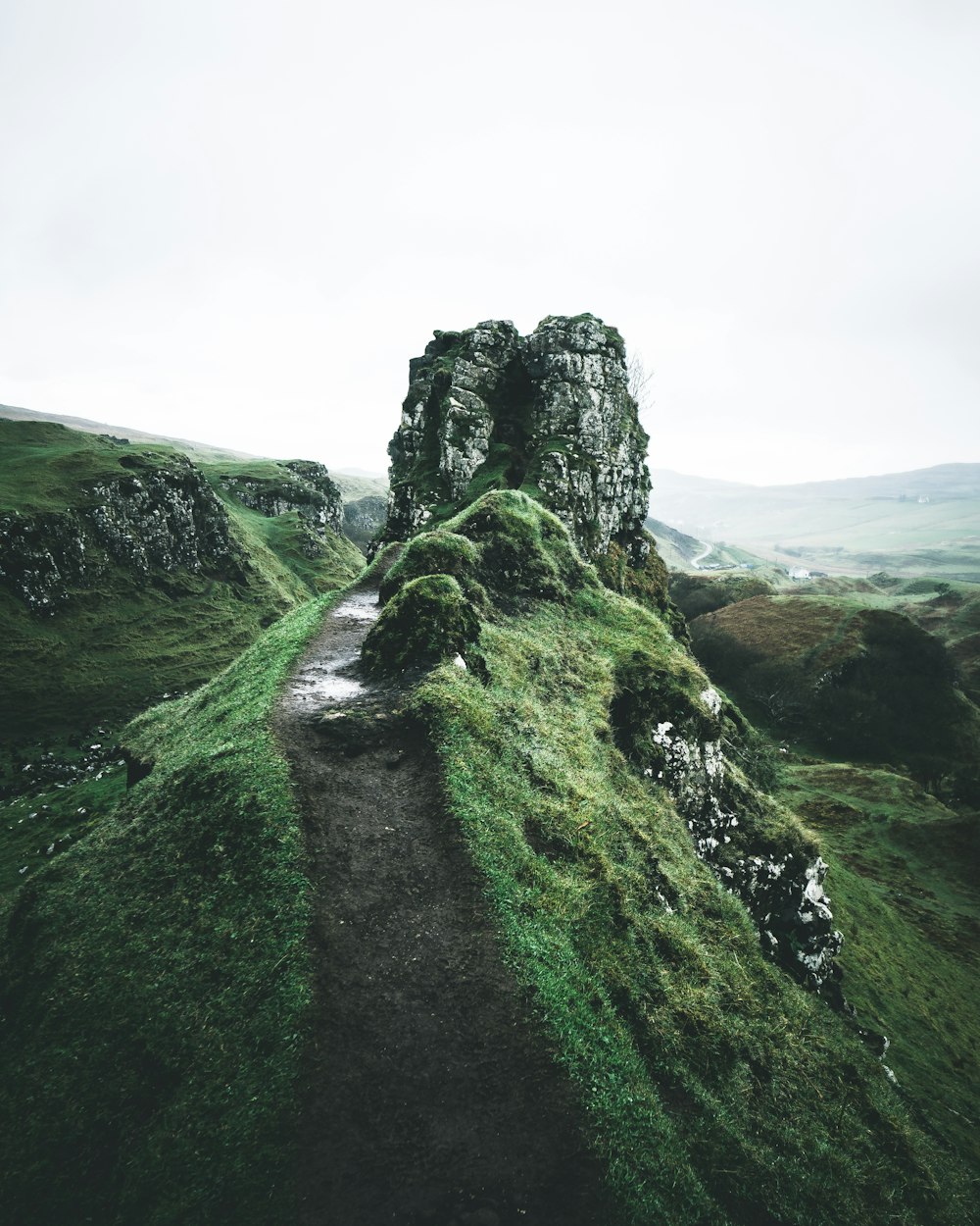 pathway near rock formation during daytime