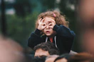 girl making hand gesture on her face