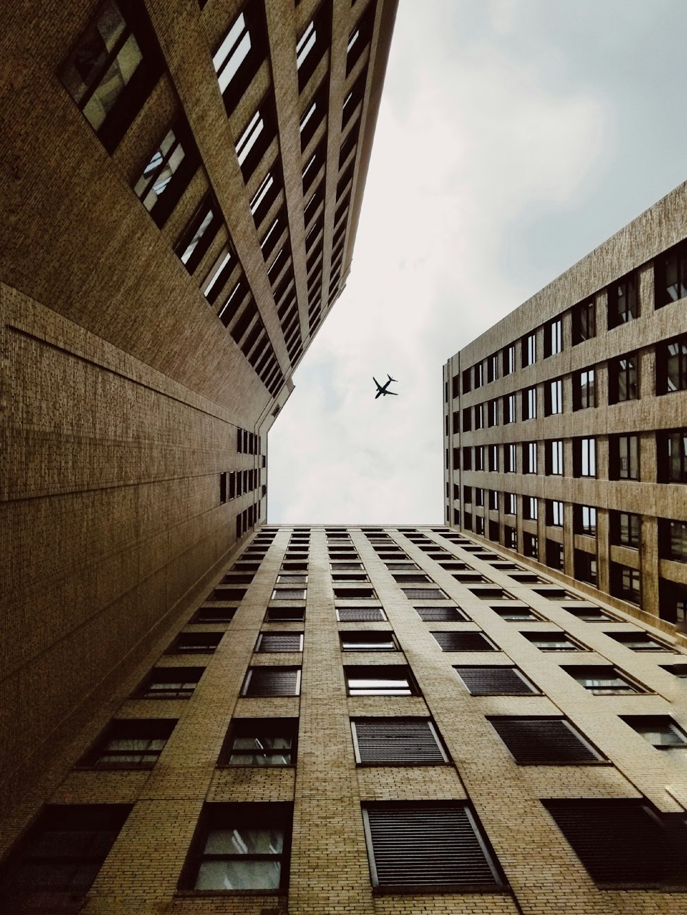 worm's-eye view photography of brown building