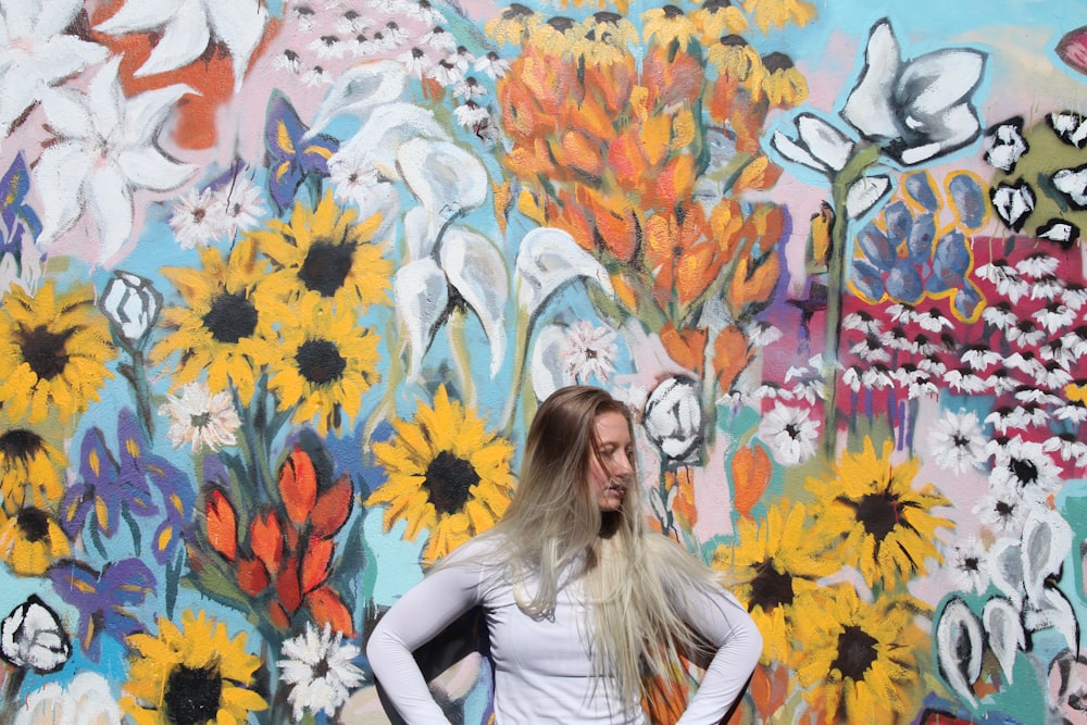 woman standing in front of graffiti