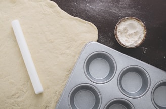 Flexible silicone baking mats rolled out on a countertop with dough