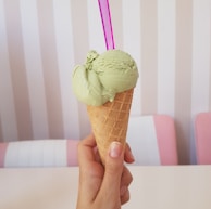 woman holding green ice cream