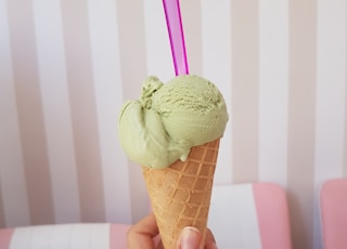 woman holding green ice cream