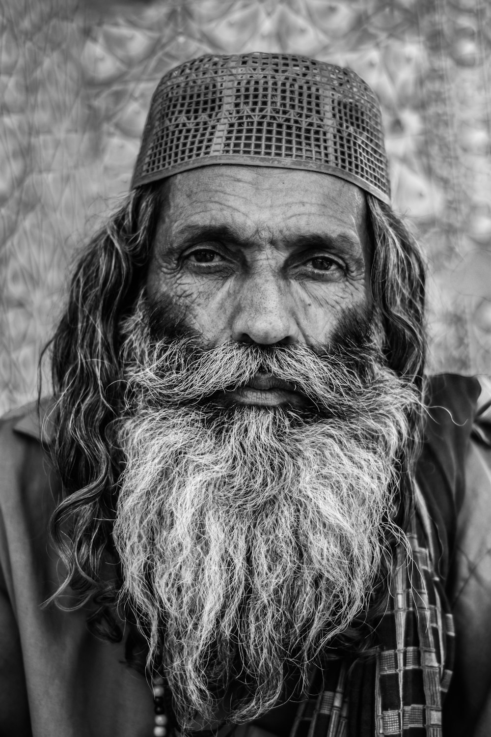 grayscale photo of man in cap