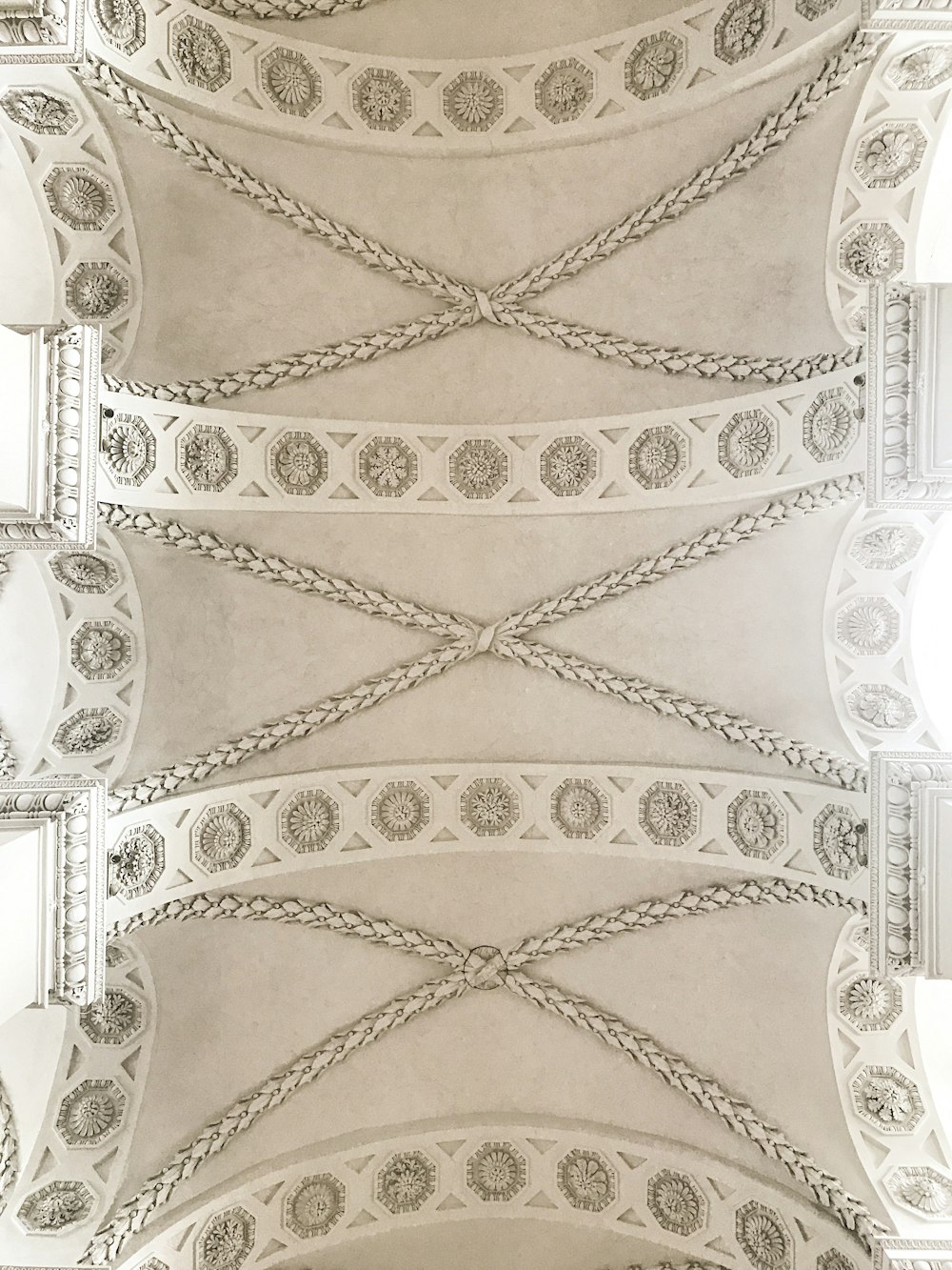 the ceiling of a building with intricate designs