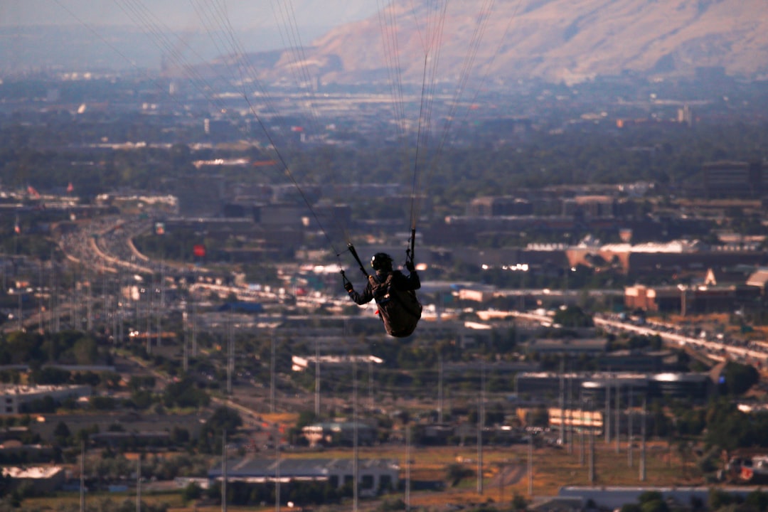 person in black long-sleeved shirt parachuting