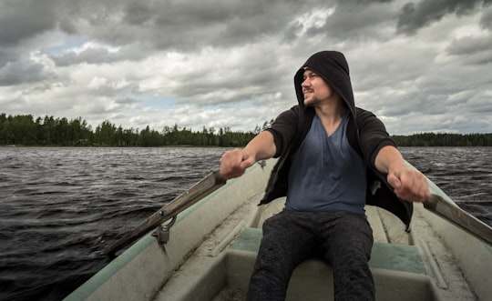 man rowing boat in Sulkava Finland