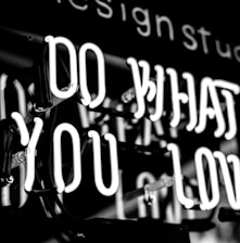 greyscale photo of DO What YOu Love signage