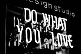 greyscale photo of DO What YOu Love signage