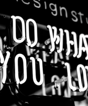 greyscale photo of DO What YOu Love signage