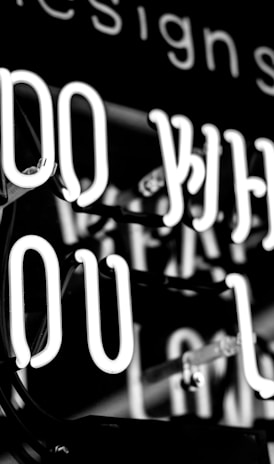 greyscale photo of DO What YOu Love signage