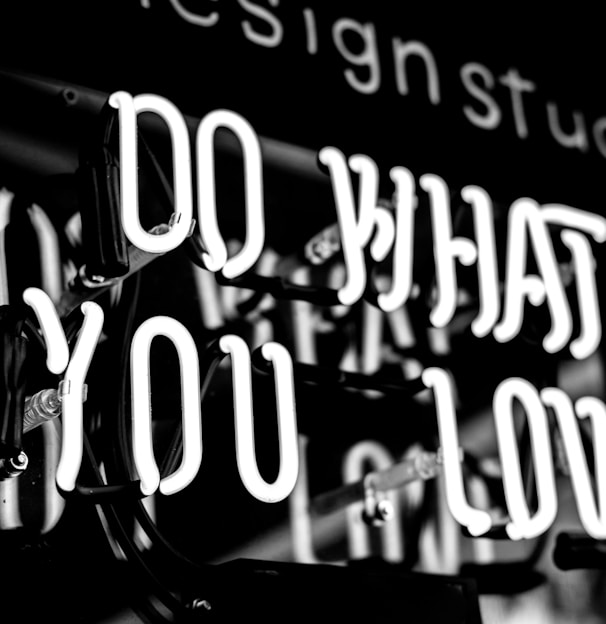 greyscale photo of DO What YOu Love signage