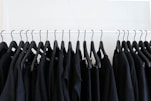 black clothes hanged in rack