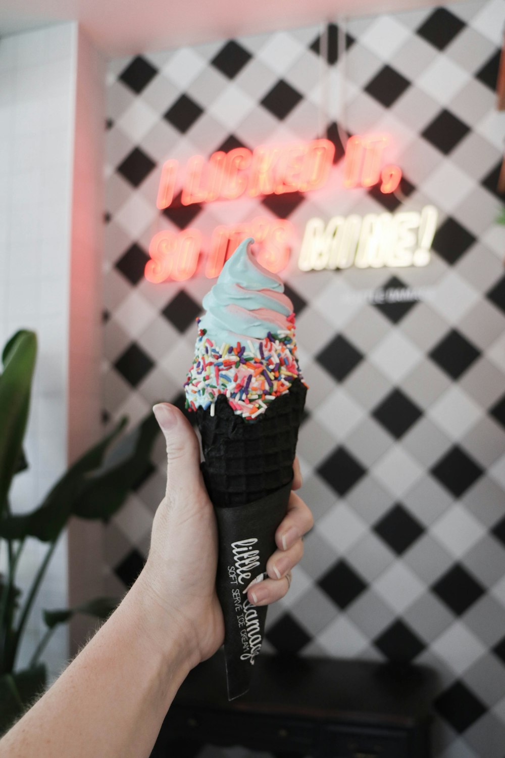 person holding holding flavored ice cream