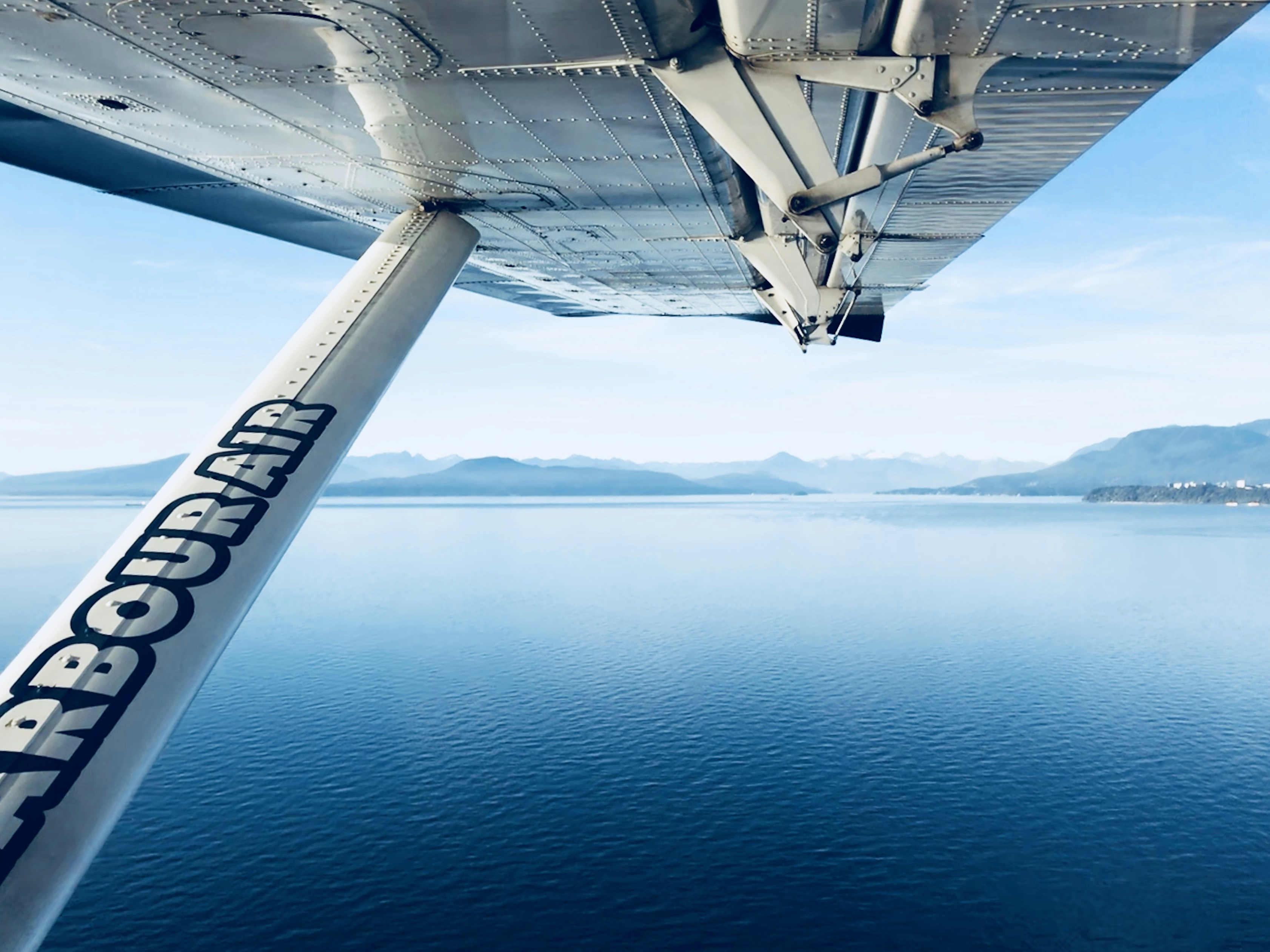 white airplane wing, Flying from Fraser River YYV to Nanaimo on Vancouver Island, October 2017