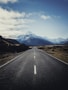 road near mountain during daytime