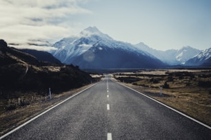 road near mountain during daytime