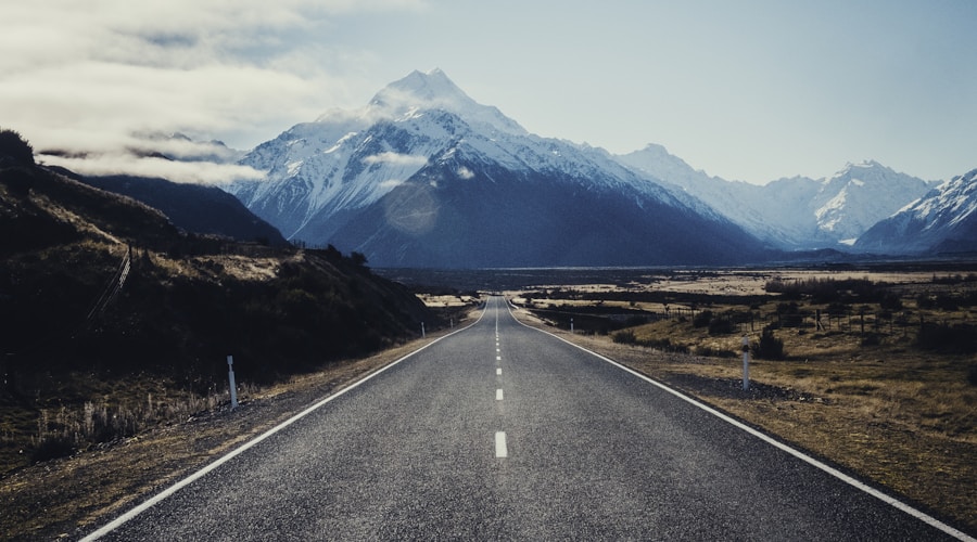 road near mountain during daytime