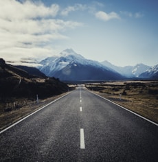 road near mountain during daytime