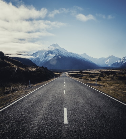 road near mountain during daytime