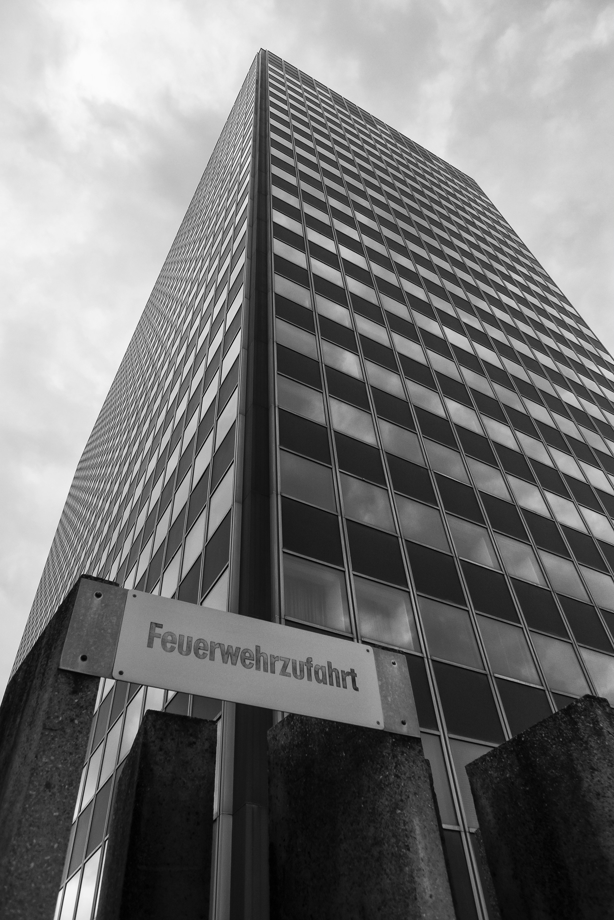 gray concrete building under cloudy sky