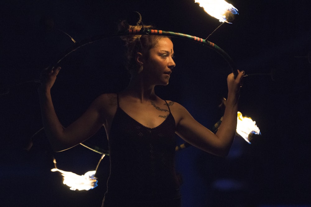 woman fire dancing during night