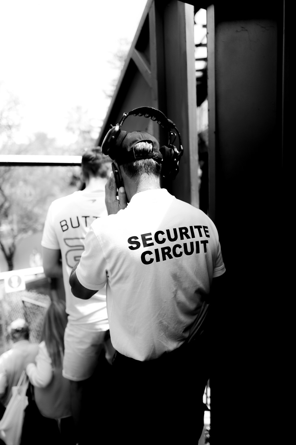 security personnel with headphones grayscale photo