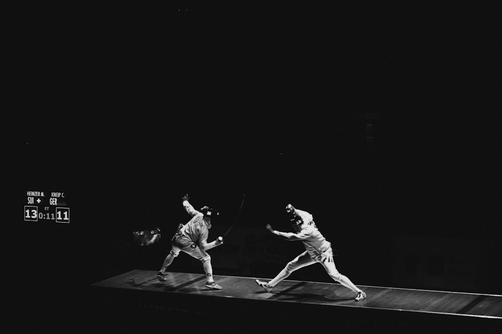 two people fencing