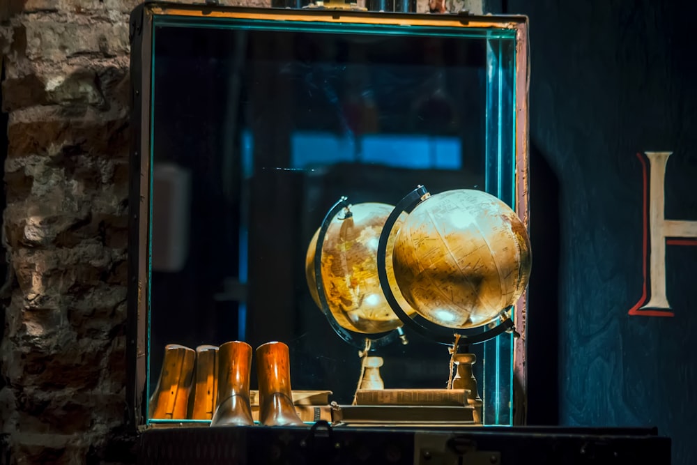 beige desk globe front of mirror