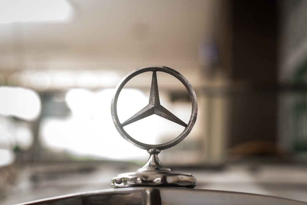 gray Mercedes-Benz hood ornament