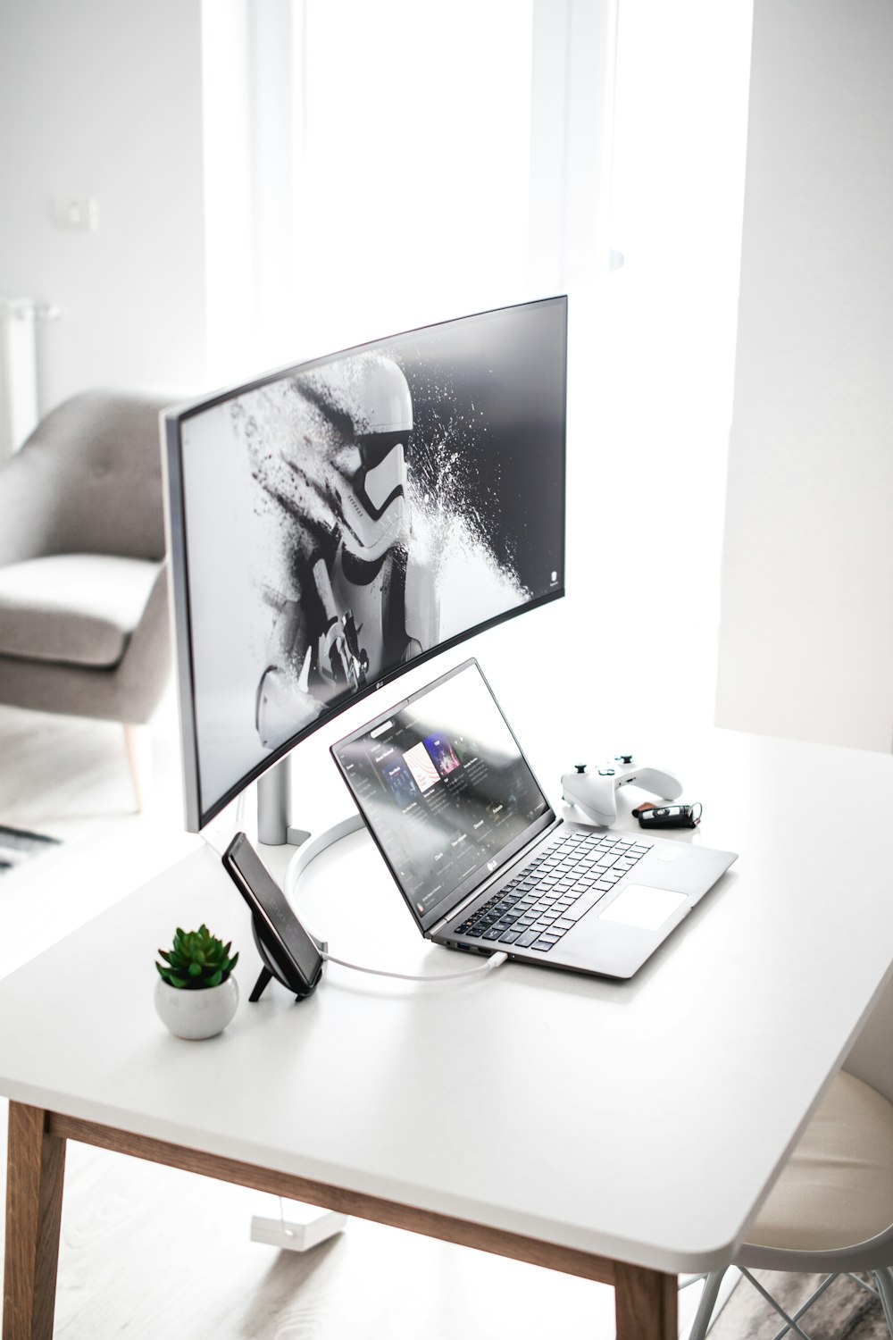 silver laptop on table