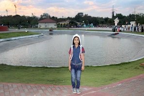 A child happily playing in a park while wearing a discreet TagGuardian location tag.