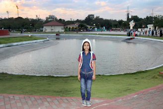 A child happily playing in a park while wearing a discreet TagGuardian location tag.