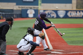 baseball player swinging bat