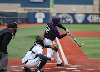 baseball player swinging bat