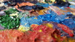 Close-up of a contemporary painting with bold colors and clean lines.