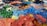 Close-up of a colorful oil painting with textured brushstrokes on canvas.