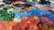 Close-up of detailed brushstrokes on a colorful abstract painting.