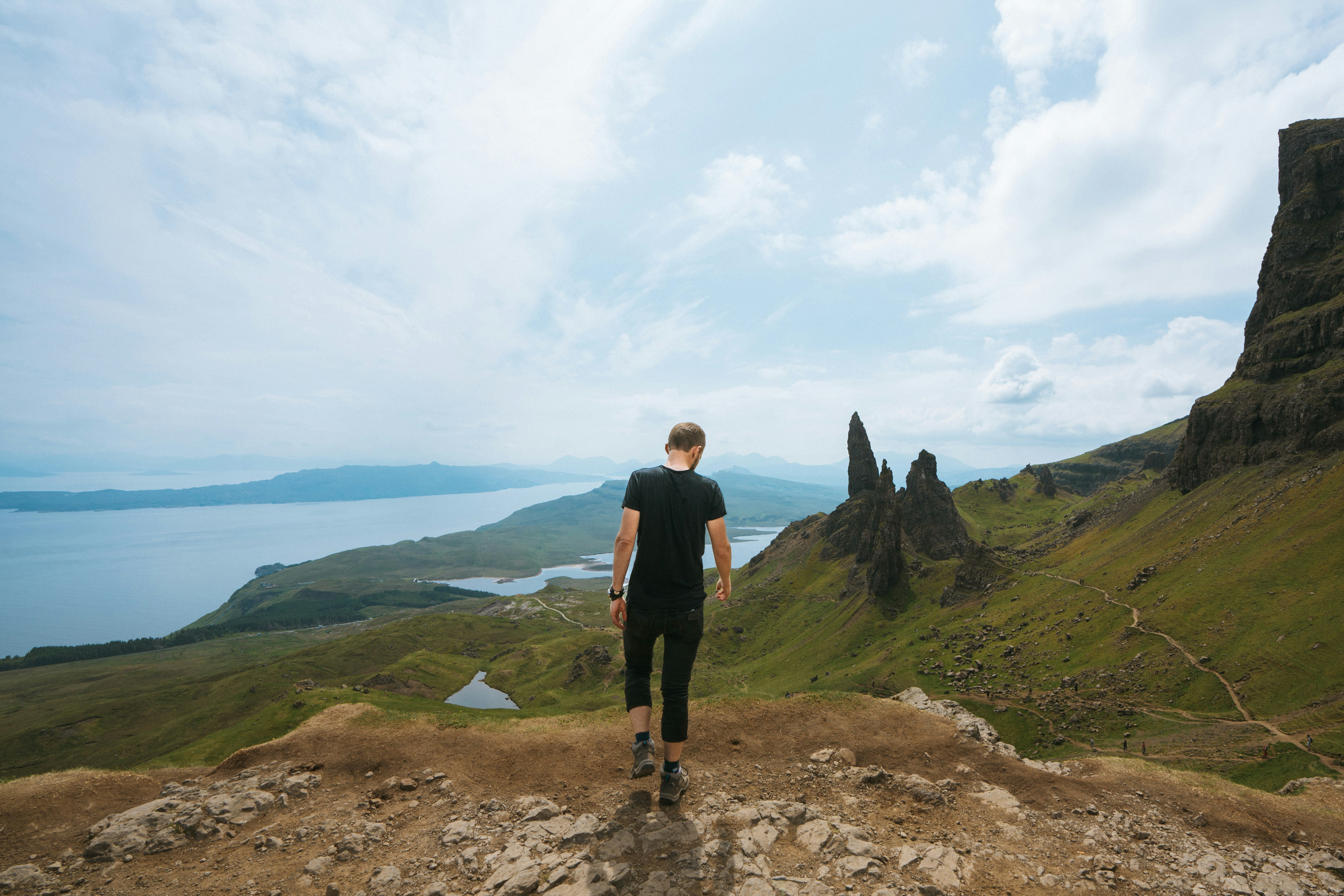 man standing on mountain peak