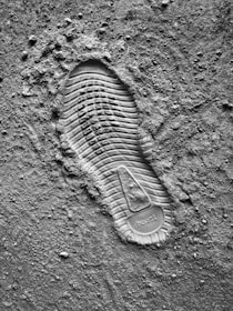 grayscale photo of sneaker sole print
