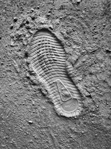 grayscale photo of sneaker sole print