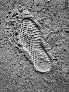 grayscale photo of sneaker sole print