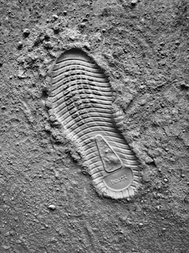 grayscale photo of sneaker sole print