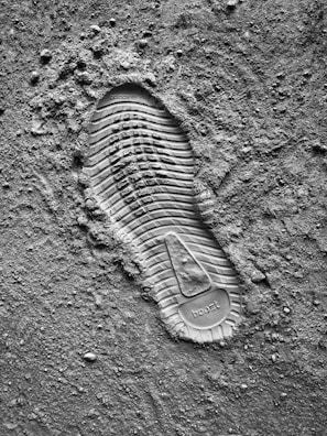 grayscale photo of sneaker sole print