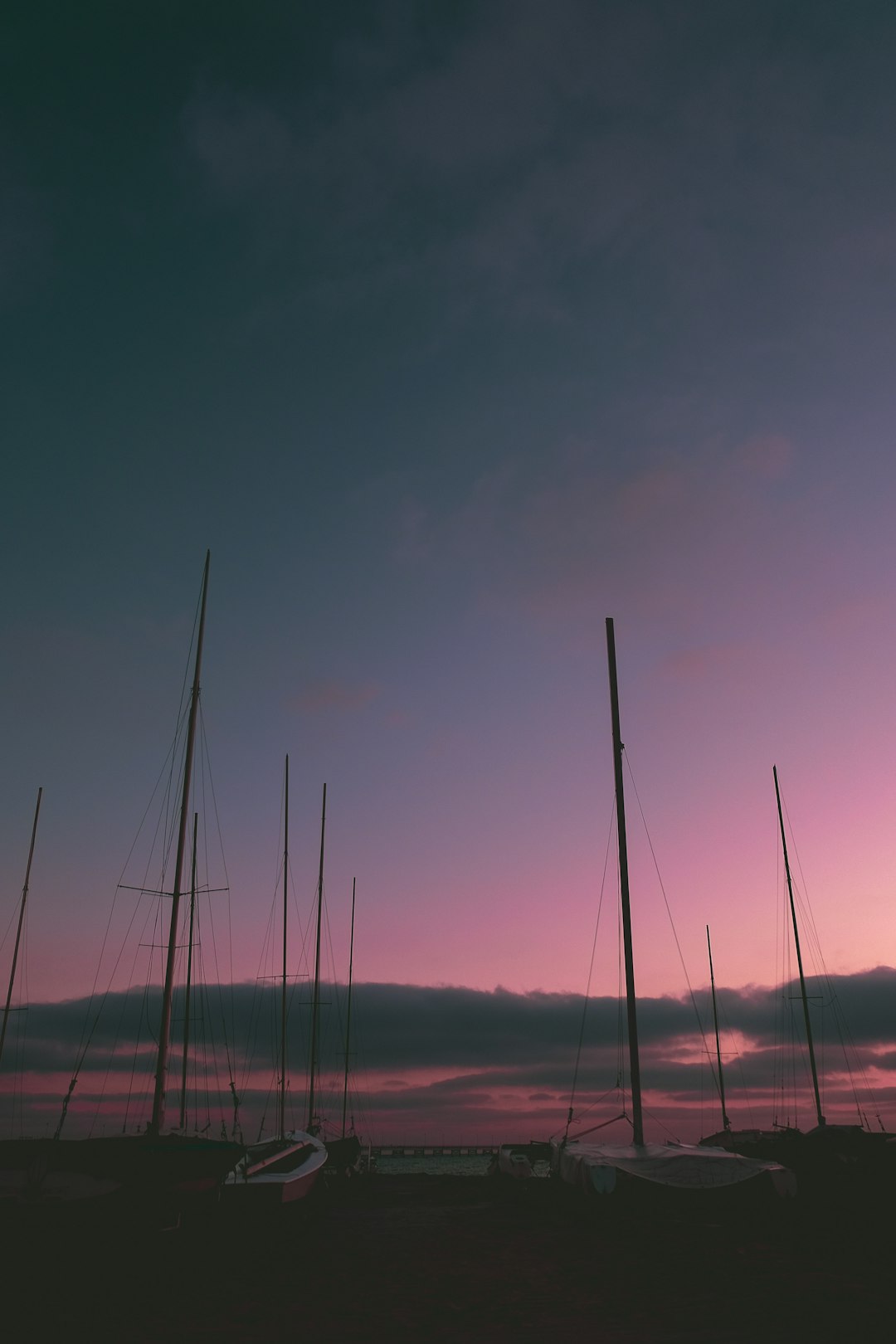 photo of boats near body of water