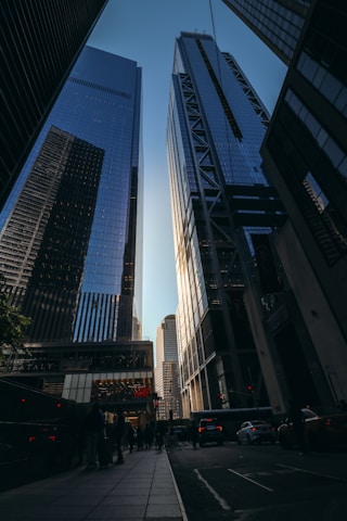 people walking on the side walk during daytime