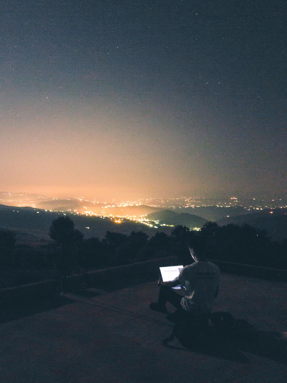 photo of man staring on laptop