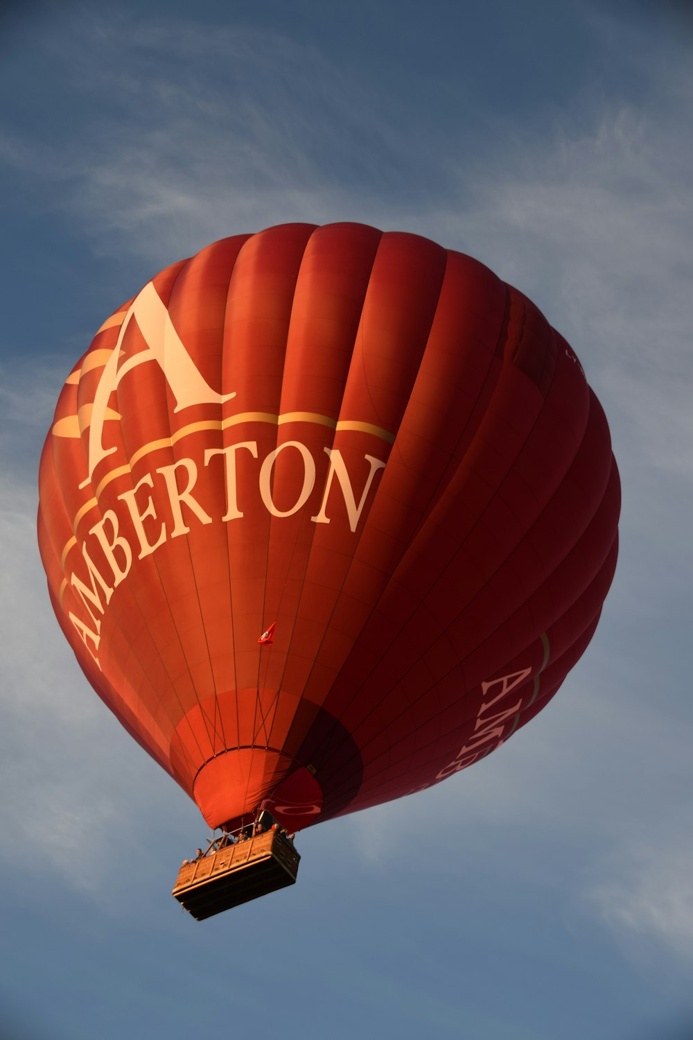 low angle photo of red Amberton hot air balloon